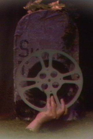 film reel out of grave